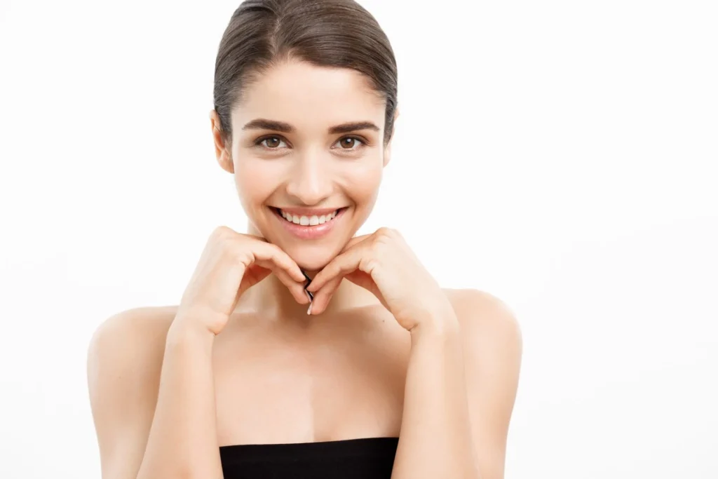 Beauty and spa concept - Charming young woman with perfect clear skin over white background
